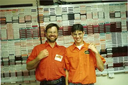 Two people waering an orange uniform