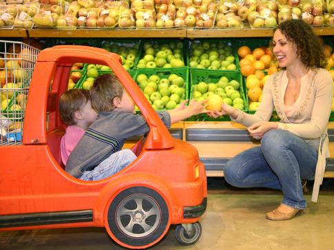 Two child riding in the mini car