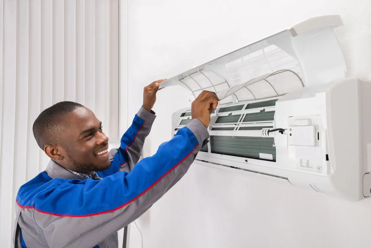 Man repairing a air conditioner